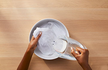 Woman hands washing clothes